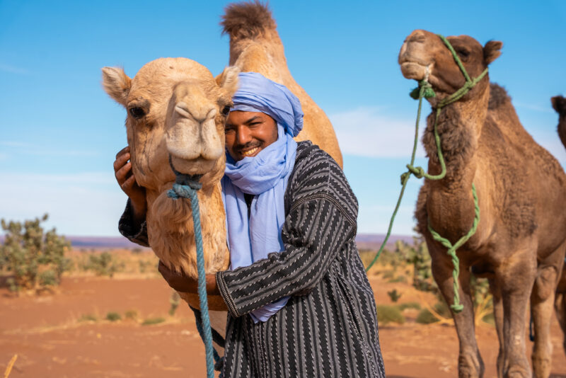 Hocin & Camel at Ahlan Camp, showing off his favourite camels